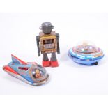 Vintage Japanese tin-plate space toys, including Attacking Martian by Horikawa,