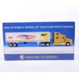 Franklin Mint precision model; The Peterbilt model 387 tractor with trailer 1:32 scale, boxed.