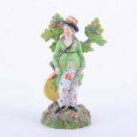 Staffordshire pearl glazed earthenware bocage figure of a lady archer, circa.