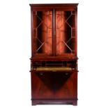 Reproduction mahogany bookcase in the Georgian style, dentil moulded cornice, plain frieze,