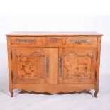 Provincial French elm and fruitwood dresser base, fitted with three drawers over two panelled doors,