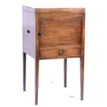 George III style mahogany bedside cupboard, hinged lid, above a door and drawer,