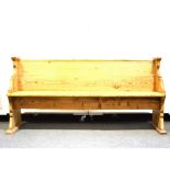 Pine pew, boarded back and seat, shaped ends, length 175cm, depth 51cm, height 84cm.
