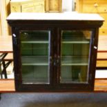 A stained wood and painted two door cabinet, glazed panelled doors, width 78cm.