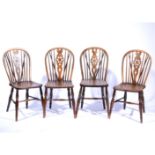 Four beech and elm wheel back Windsor chairs, turned legs and rails, 37cm.