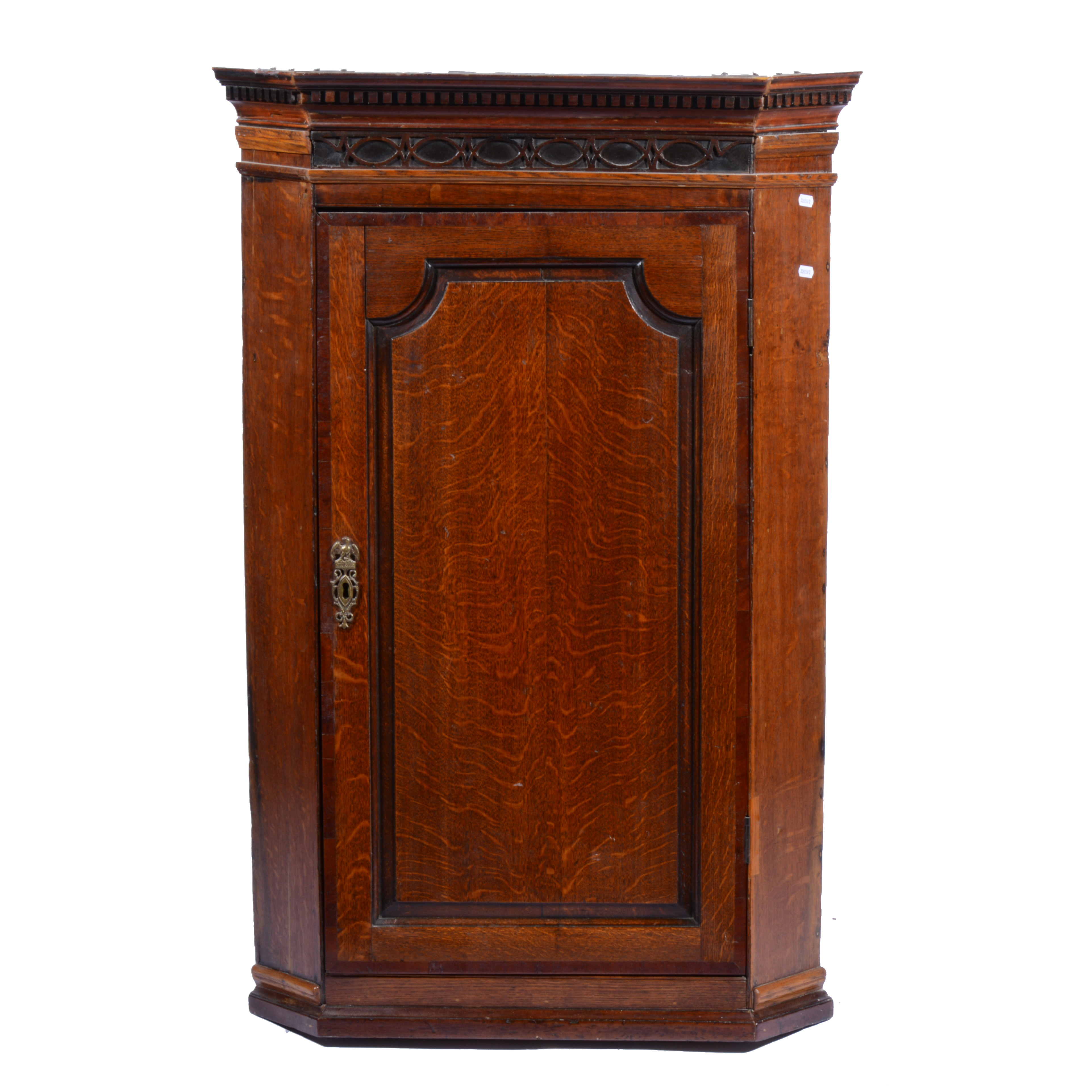 George III and later oak and mahogany hanging corner cupboard, cavetto and dentil moulded cornice,