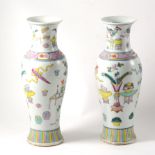 Pair of Chinese Famille Rose baluster shape vases, decorated with objects, 30cm.