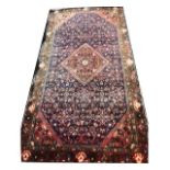 Persian pattern rug, red lozenge, patterned field.
