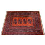 Bokhara rug, four guls on a red ground, multi-bordered, 175 x 136cms.