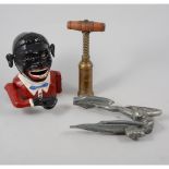 Brass corkscrew, fruitwood handle; cast iron money box; lantern, and a metal car mascot,