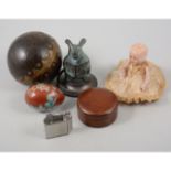 A leather and brass ringed ball, glass animal ornaments, hedgehog, penguin, rhinoceros,