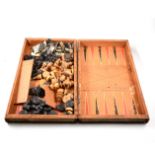 Leather covered book design folding chess board, containing boxwood and ebony chess men,