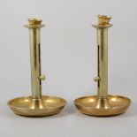 Assorted copper and brass, including push-up candle stands.