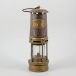 A 19th Century brass miners lamp, by E. Thomas and Williams of Aberdare, 28cm.