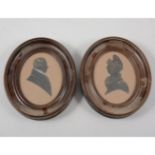 Pair of early Victorian silhouettes, lady and gentleman with painted detail, 10cm x 8cm.