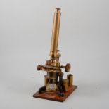Victorian lacquered brass microscope, the lens case engraved H.