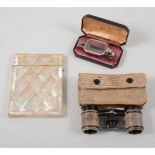 Mother of pearl card case, lorgnettes, in leather case and a pair of opera glasses,