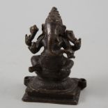South East Asian bronze effect figure of Ganesha, 14cm.