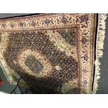 Persian pattern rug, central medallion on dark blue grounder with allover floral design,