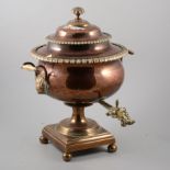 William IV brass and copper campagna tea urn, twin ivory handles, 46cm.