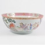 A Chinese famille rose bowl, the exterior painted with figures, in the interior with a floral spray,