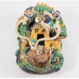 Chinese lead glazed earthenware wall pocket, designed with a sea serpent, 25cm.