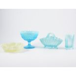 Large collection of vaseline glass, including comports, jugs, bowls, vases.