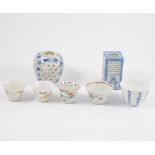 Three Chinese blue and white cricket jars, and a small collection of tea bowls and saucers.