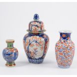 A collection of Japanese Imari wares, three lidded jars, a 30cm charger, four plates,