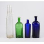 Assorted medicinal bottles and an Essolube glass bottle.