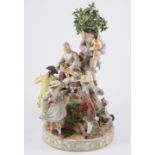 Large Meissen style group, revellers by a tree, bears underglaze blue crossed swords mark, 38cm,