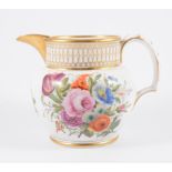 A Swansea jug, painted with a panel of flowers, gilt borders, 13.5cm.