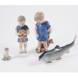 Four Copenhagen porcelain models of children, various sizes; Copenhagen salmon,