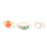 Three gemset dress rings, a round cabochon cut coral collet set in a yellow metal mount marked 750,