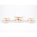 A modern Royal Crown Derby tea service, a stylised Imari pattern, seven tea cups and saucers,