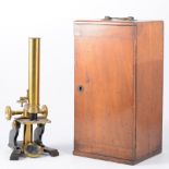 Victorian brass monocular microscope, 30cm, together with a fitted mahogany case.