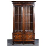 Oak bookcase, 1940s, moulded cornice, carved frieze,