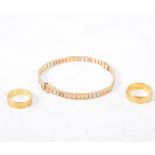 Two gold wedding rings and a bracelet, a 22 carat yellow gold wedding band, 6.