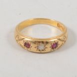 A ruby and diamond three stone ring,