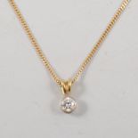 A diamond solitaire pendant and chain,