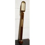 Mahogany stick barometer, arched glazed top, trunk with thermometer, turned cistern cover,