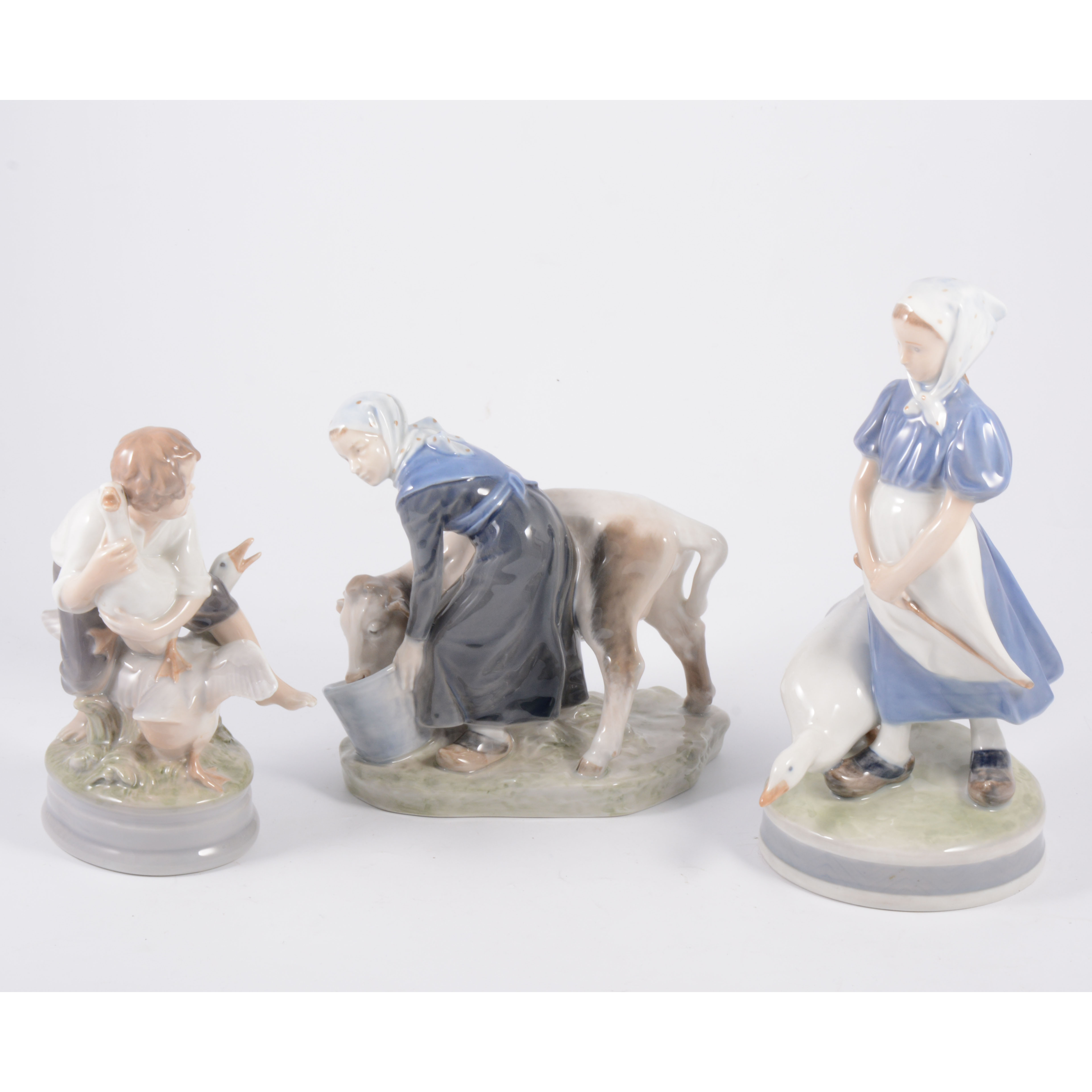 Royal Copenhagen figure, girl with a goose 527; 23cm; another figure, boy with two geese 2139, 17.