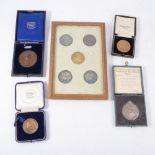 Group of four equestrian medals. together with five others, framed.