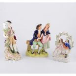 A box of miscellany - Staffordhire figures, a majolica jardiniere, Swan China nursery plates,