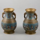 A pair of champleve enamel and cast brass two handle vases,