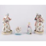 Pair of Continental porcelain figures, courting couples, in 18th Century dress,