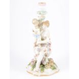 Continental porcelain figural candlestick, the column designed with a mother and child,