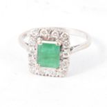 An emerald and diamond rectangular cluster ring, the rectangular emerald 7.