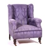 Victorian armchair, wing back, scrolled arms, turned and ringed legs, on castors, width 78cm.