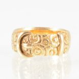 An 18 carat yellow gold buckle ring,